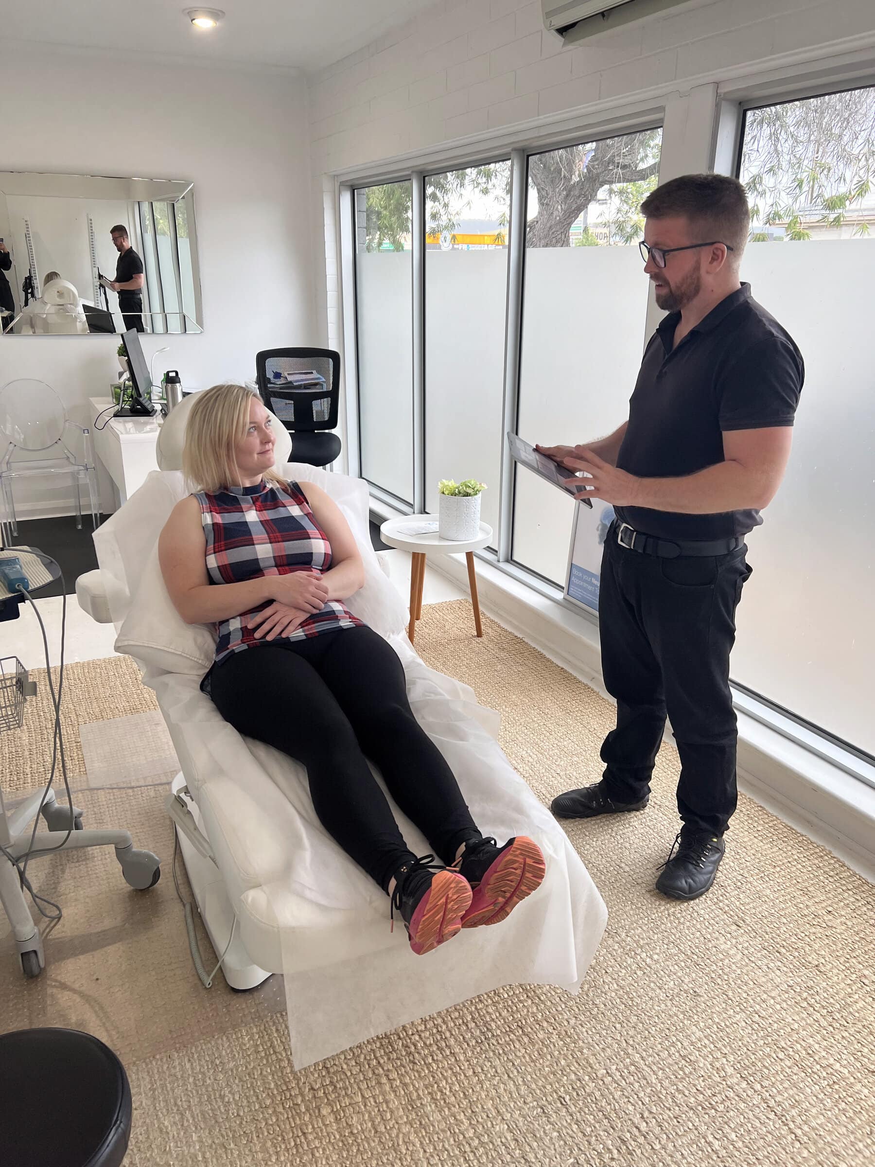 Dr Sam Johnson conducting patient assessment at Stapleton Chiropractic Adelaide