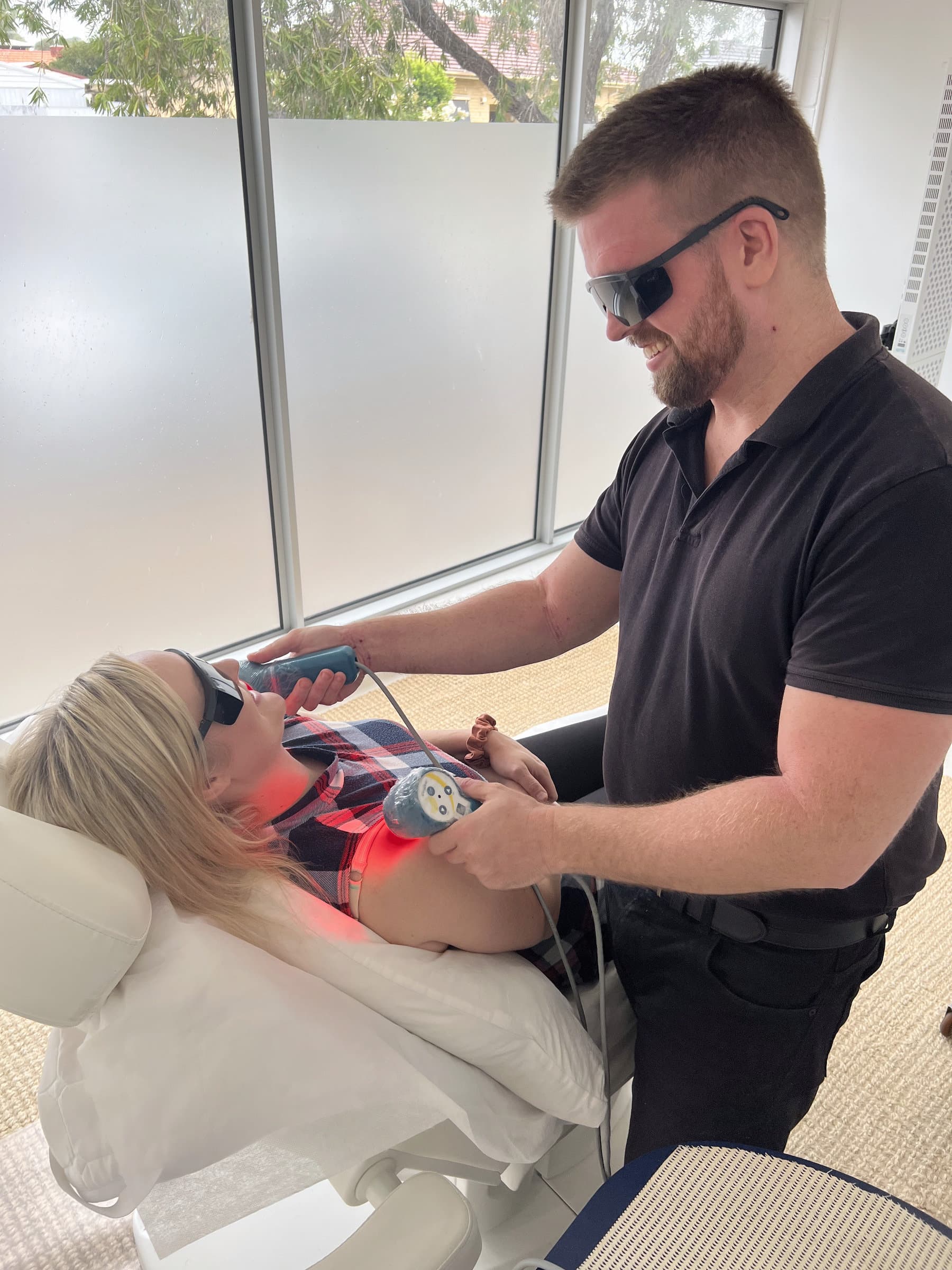 Close-up of cold laser therapy being applied at Stapleton Chiropractic Adelaide
