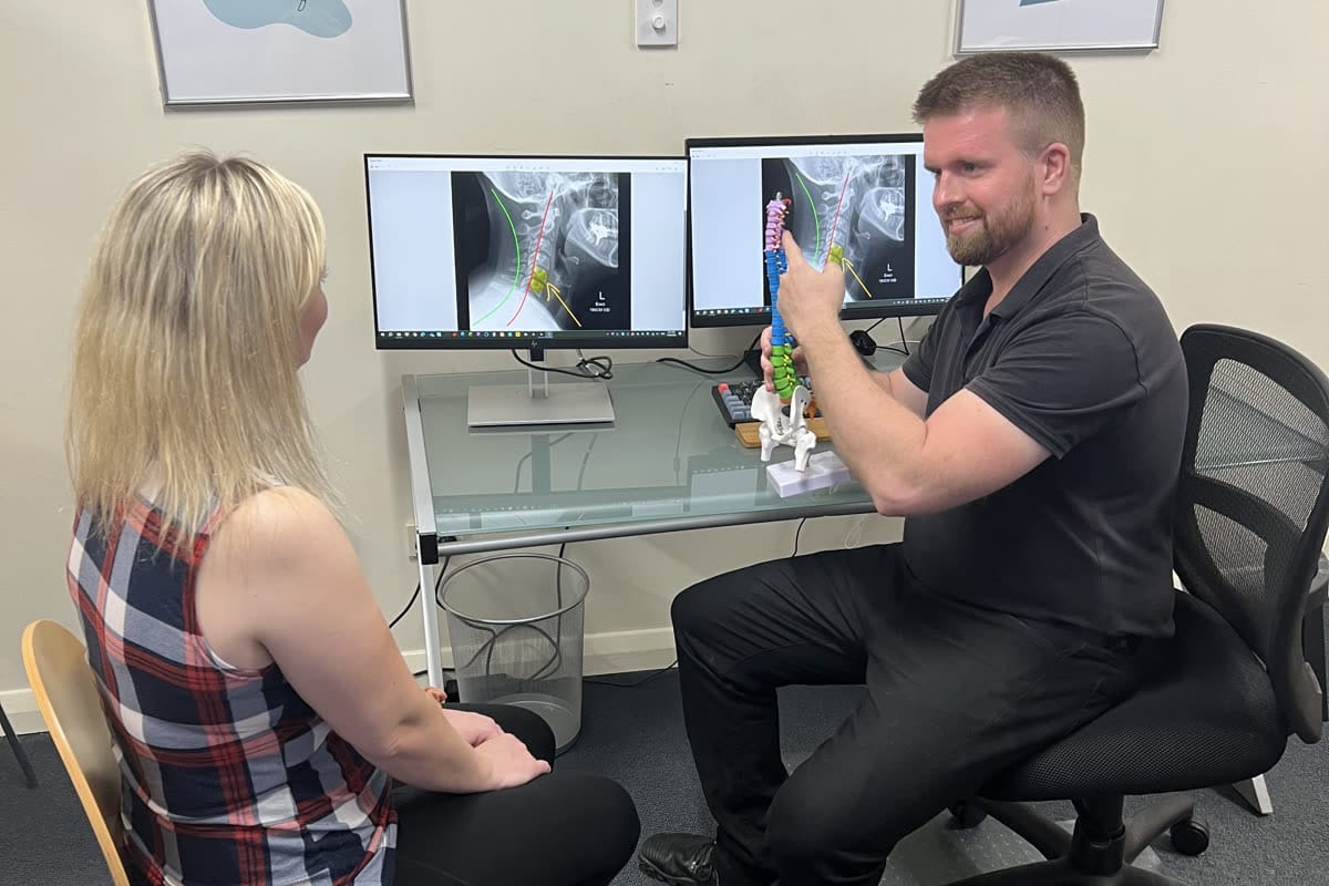 Dr Sam Johnson (Chiropractor) explaining assessment findings clearly