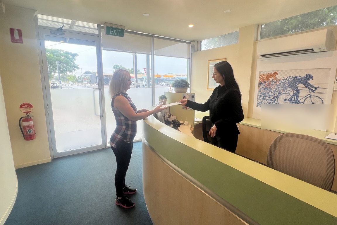 Reception at Stapleton Chiropractic during a patient handoff